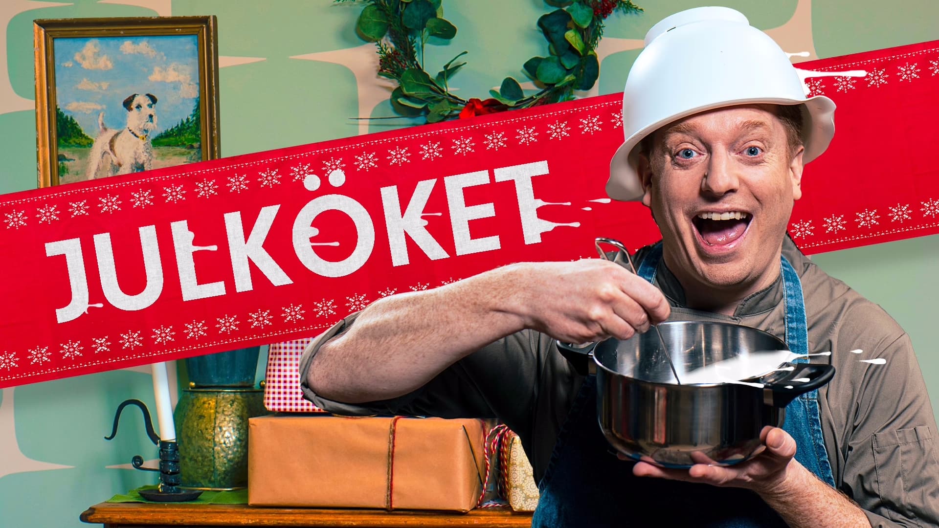 Markus Granseth med durkslag på huvudet framför Julkökets logga